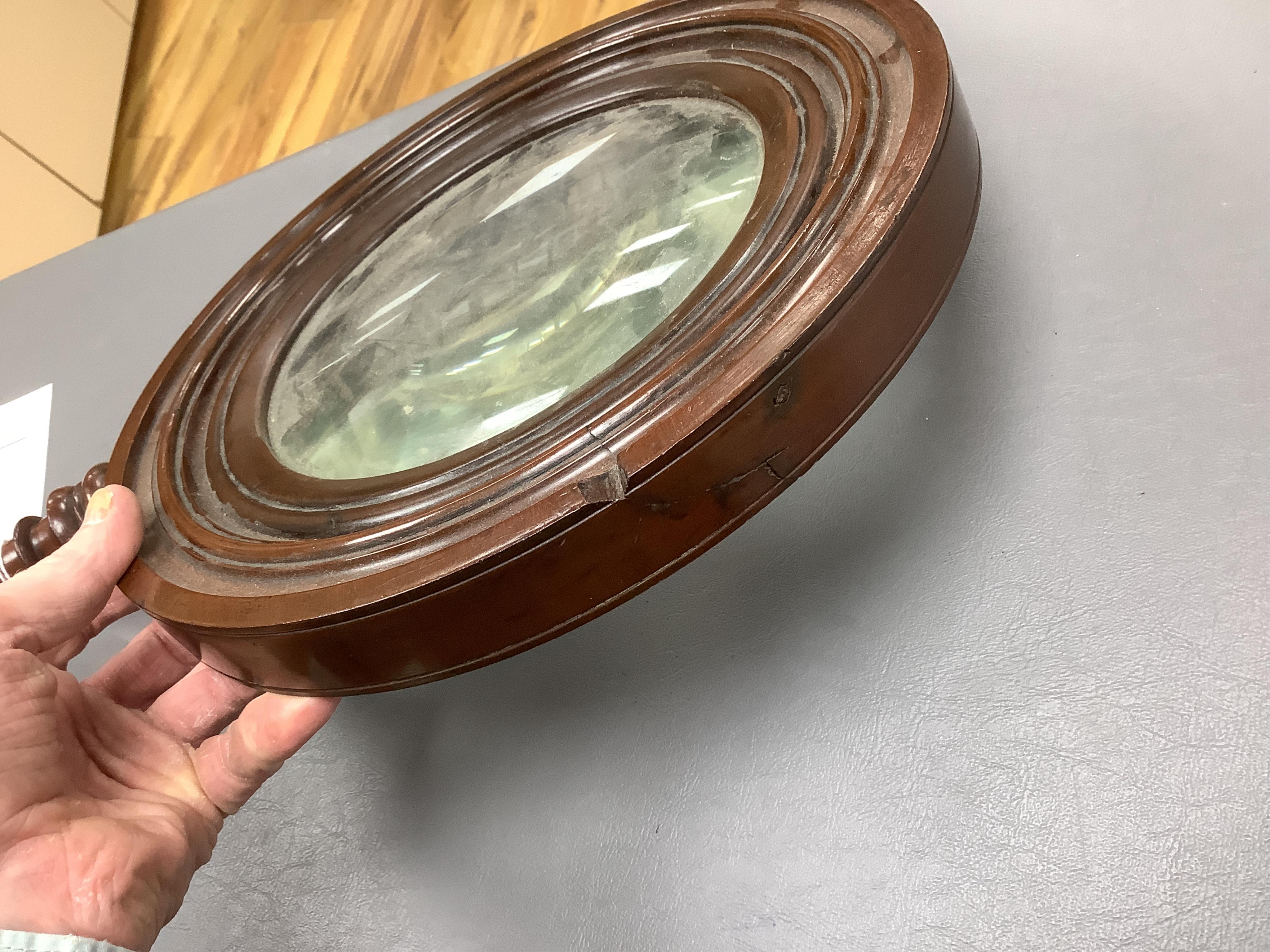 A large oversized 19th century fruitwood magnifying glass, 50cm in length